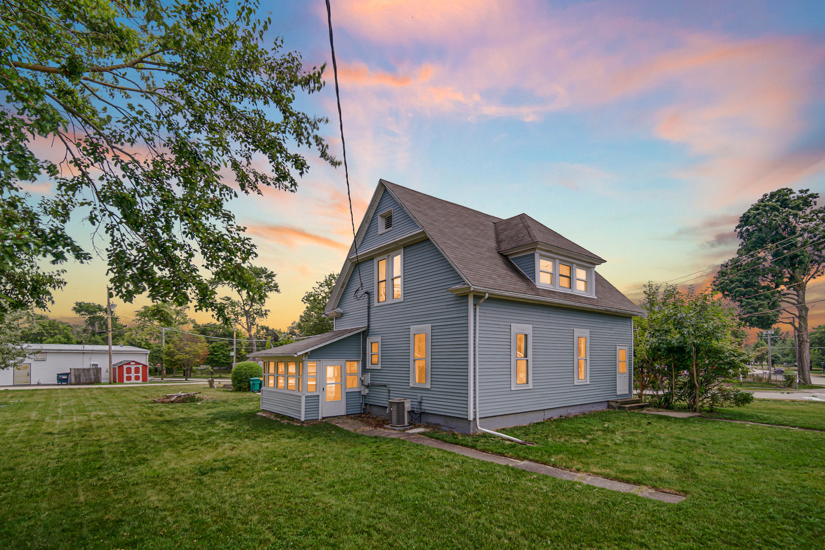 110 Wood Elwood, IL 60421 - Photo 2 of 23 a front view of a house with a garden
