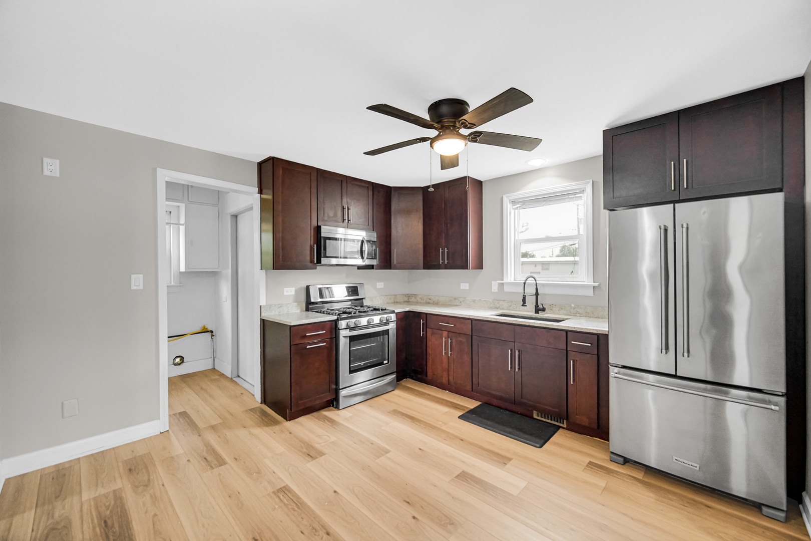 110 Wood Elwood, IL 60421 - Photo 5 of 23 a kitchen with stainless steel appliances granite countertop a refrigerator a stove top oven a sink and dishwasher