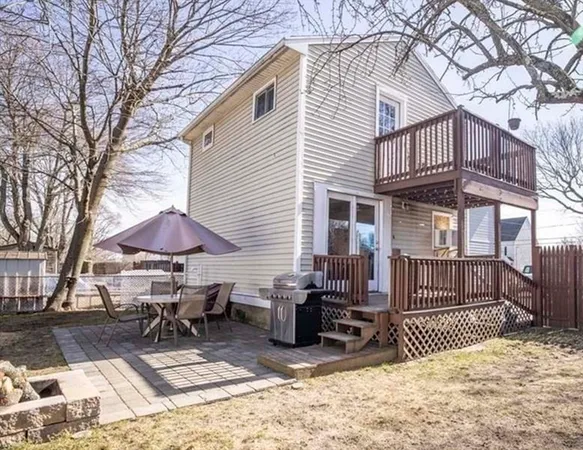 a view of a house with backyard sitting area and garden