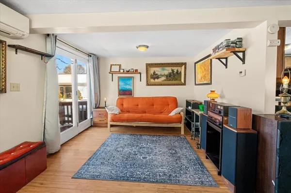 a living room with furniture and a rug