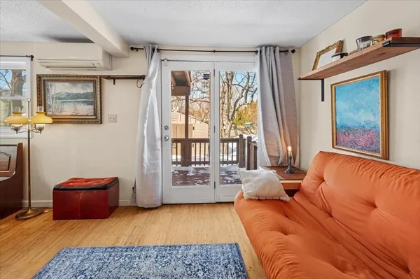 a bedroom with furniture and a window