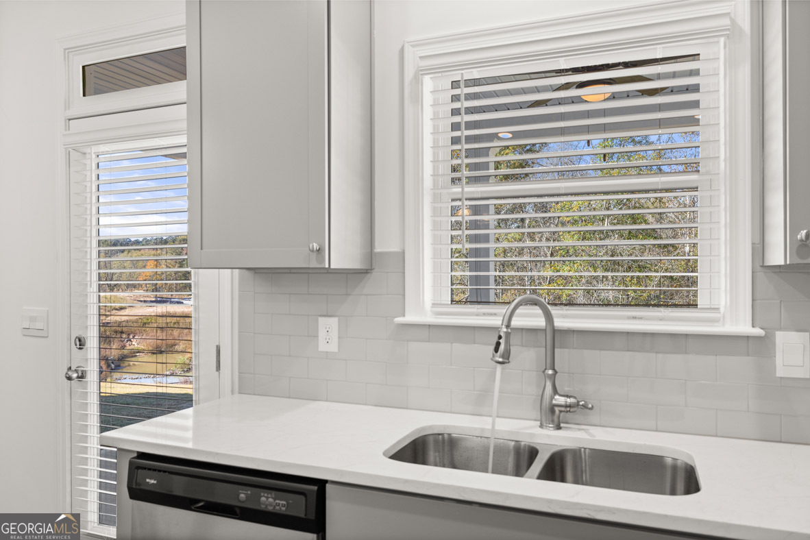 400 Hazel Drive Locust Grove, GA 30248 - Photo 17 of 50 a kitchen with a sink and a window