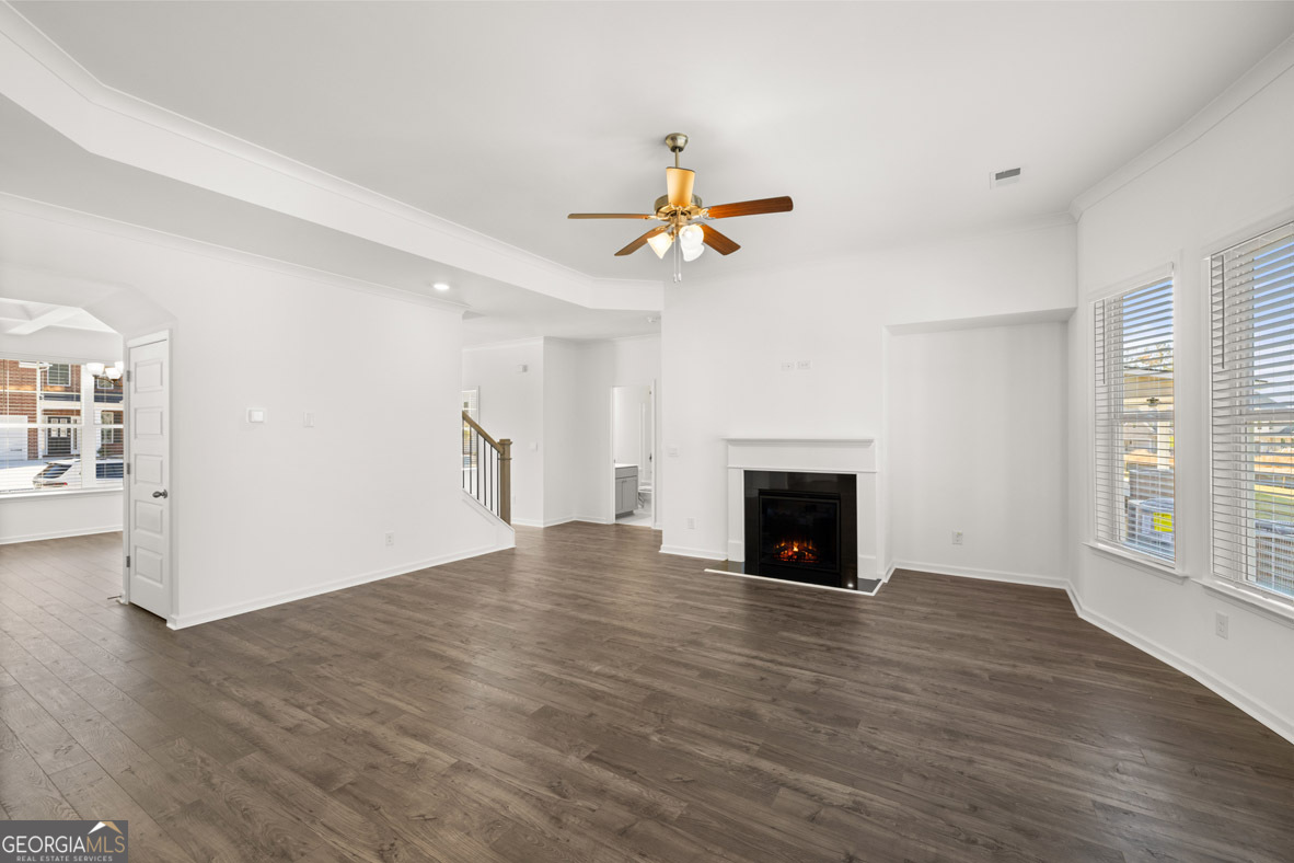 400 Hazel Drive Locust Grove, GA 30248 - Photo 24 of 50 a view of a livingroom with a fireplace and wooden floor