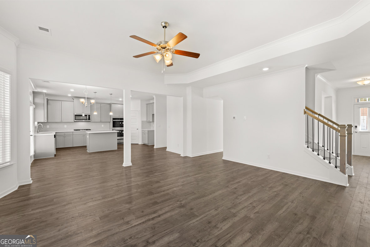 400 Hazel Drive Locust Grove, GA 30248 - Photo 25 of 50 a view of an empty room with wooden floor and a window