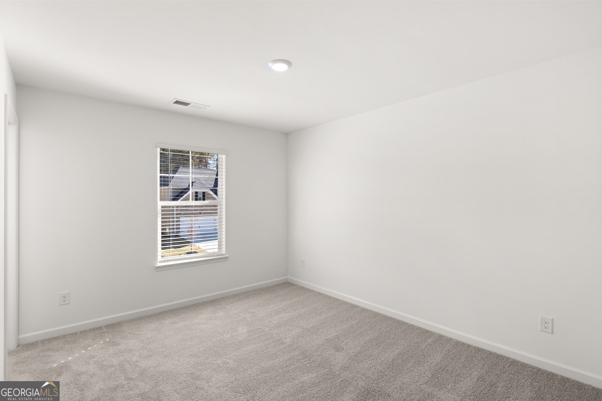 400 Hazel Drive Locust Grove, GA 30248 - Photo 42 of 50 an empty room with a window