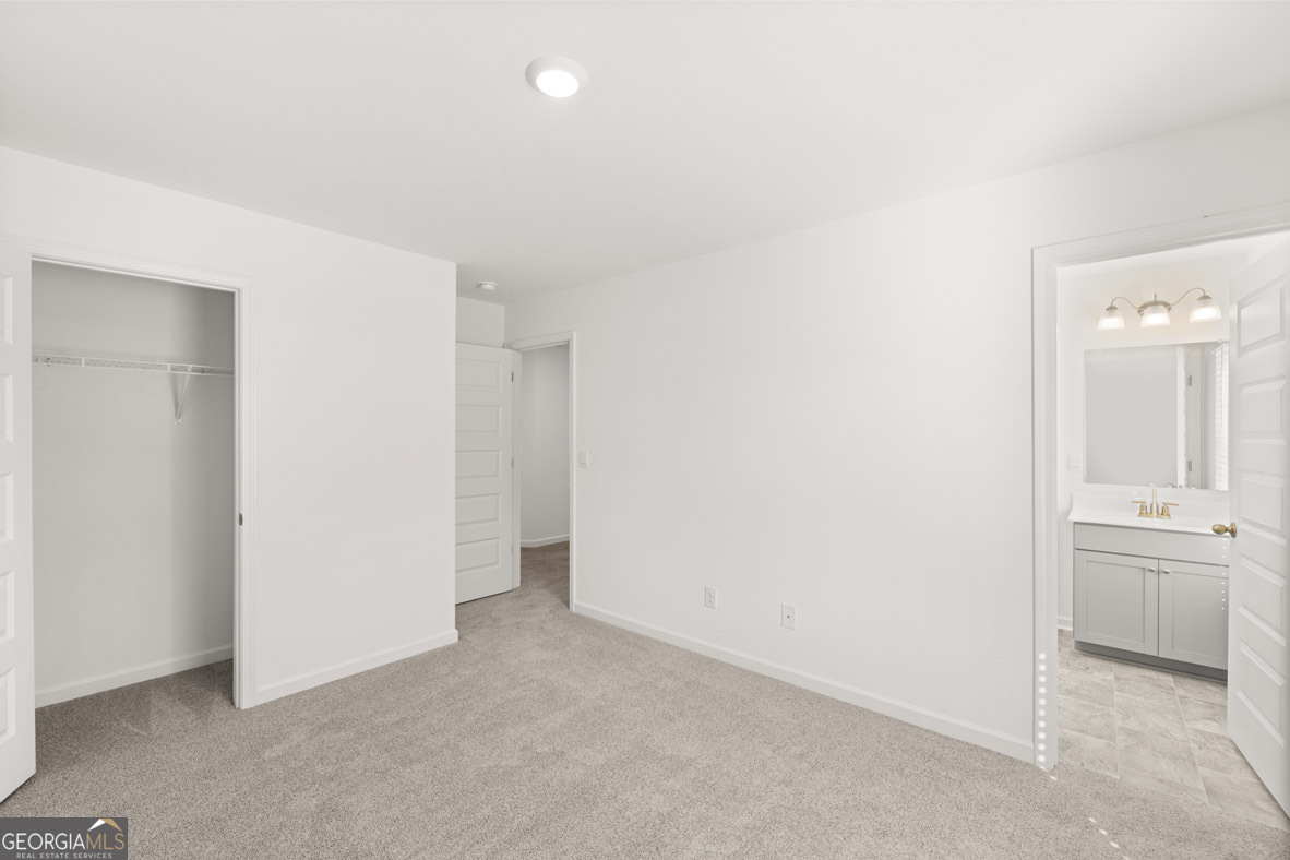 400 Hazel Drive Locust Grove, GA 30248 - Photo 43 of 50 an empty room with a bathroom