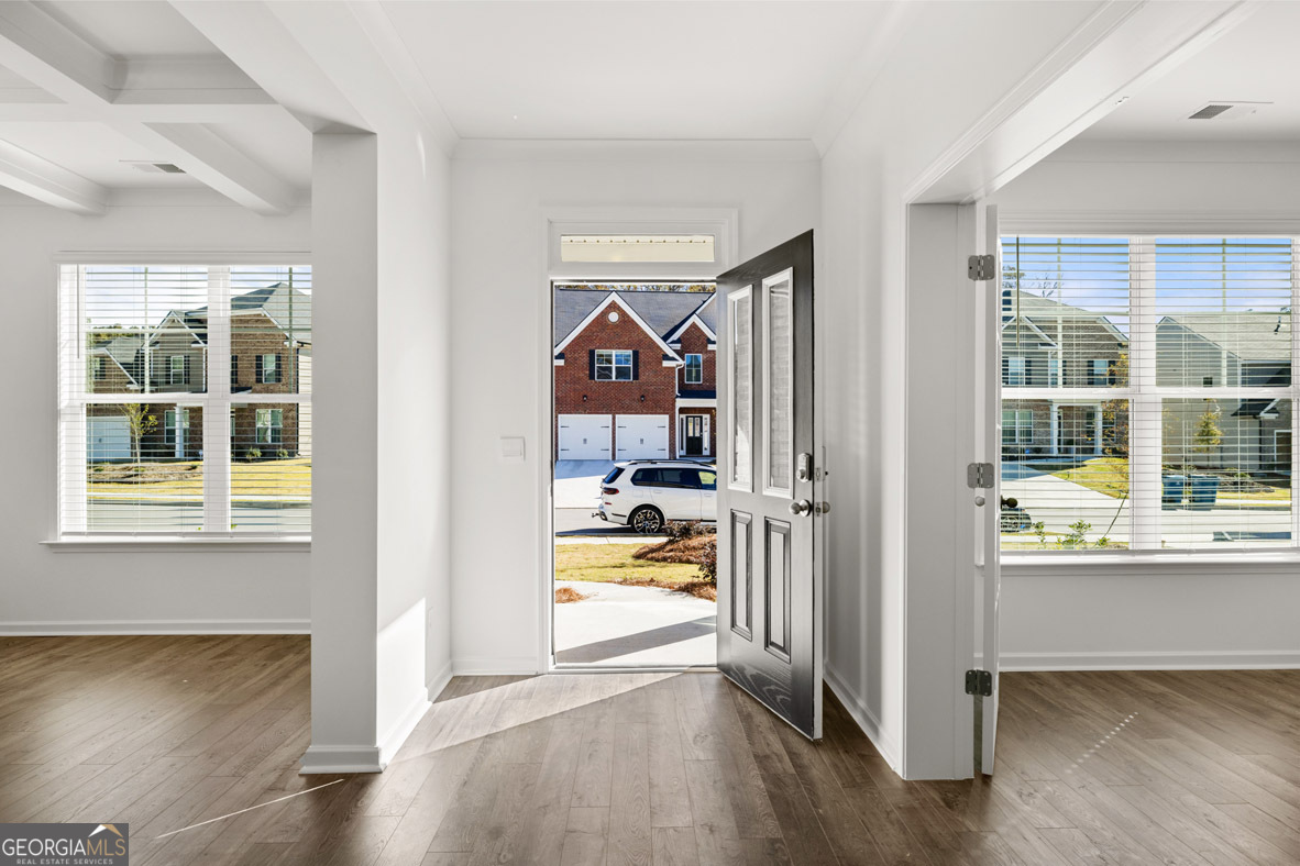 400 Hazel Drive Locust Grove, GA 30248 - Photo 8 of 50 a view of a hallway view with wooden floor and a window