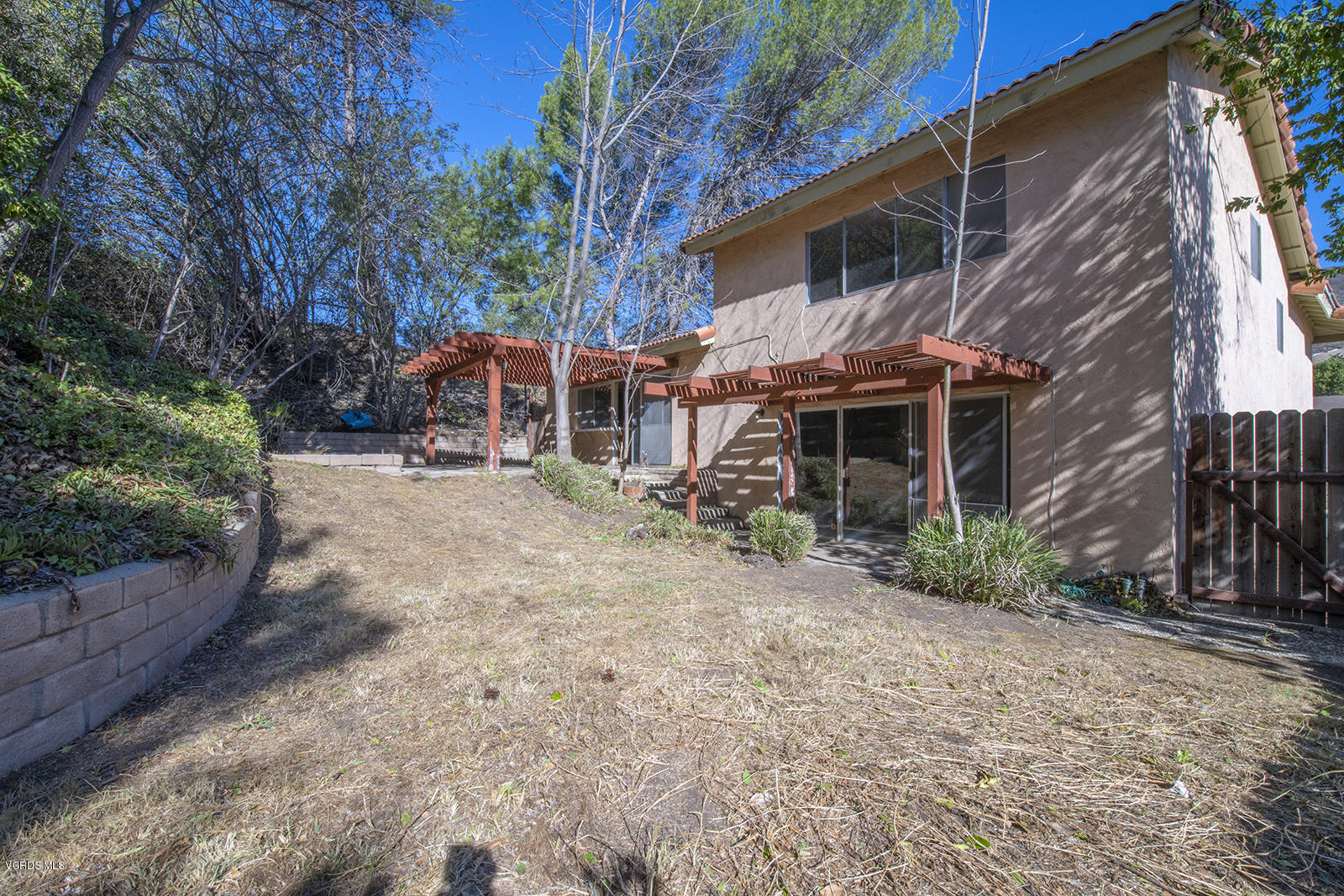 4435 Erbes Road Thousand Oaks, CA 91360 - Photo 12 of 14 a view of a house with a yard