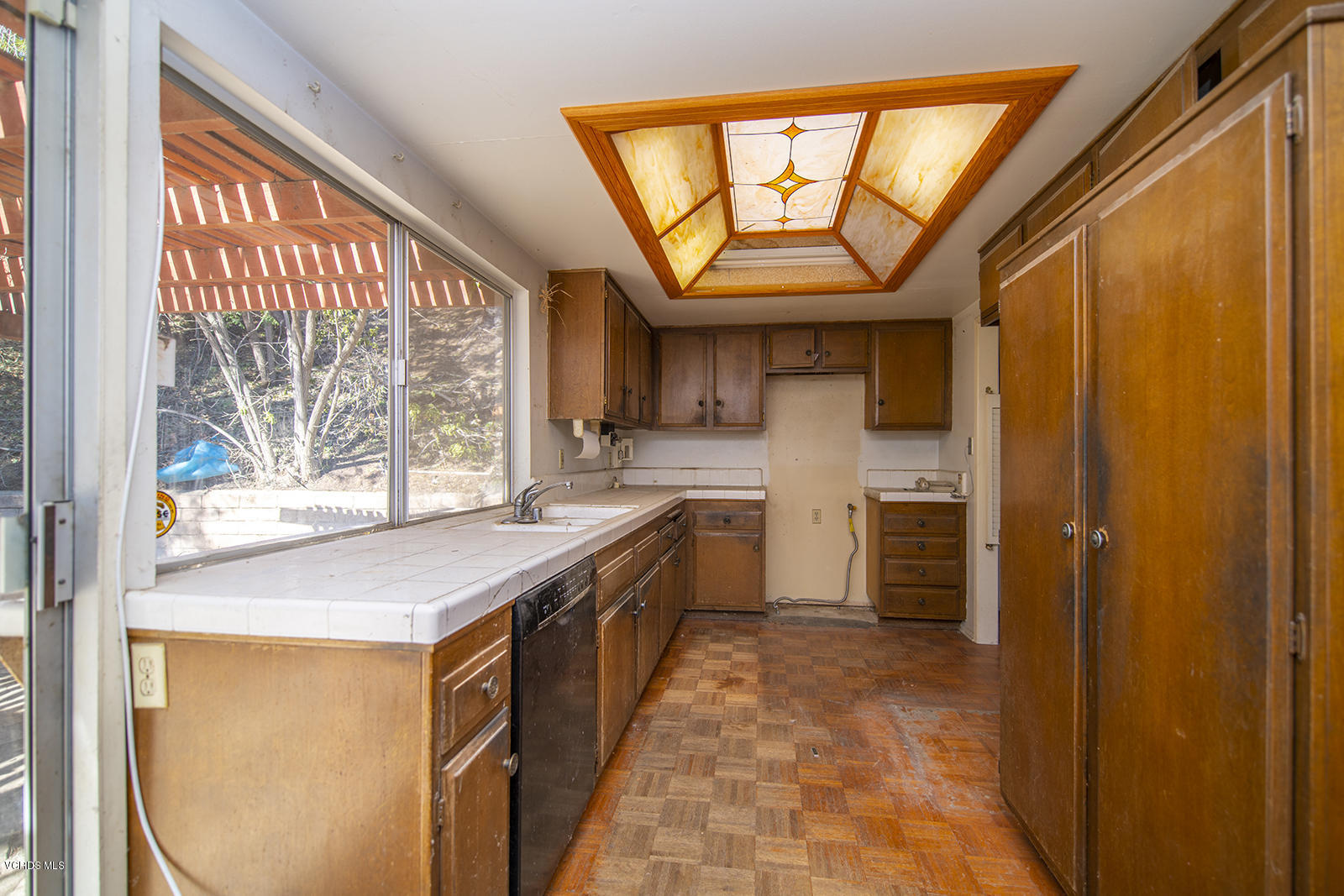 4435 Erbes Road Thousand Oaks, CA 91360 - Photo 3 of 14 a kitchen with stainless steel appliances a stove a sink and a refrigerator