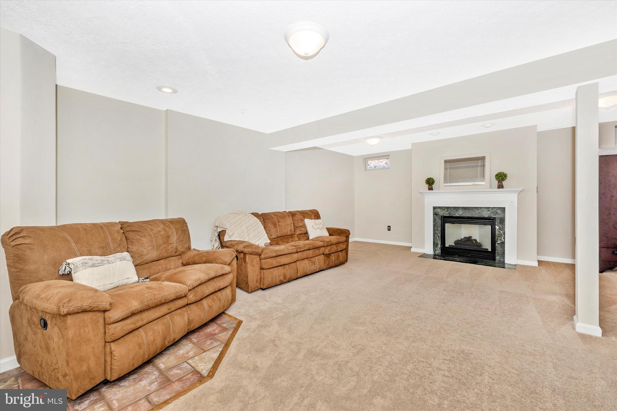 2010 Sumner Drive Frederick, MD 21702 - Photo 22 of 34 a living room with furniture and a fireplace