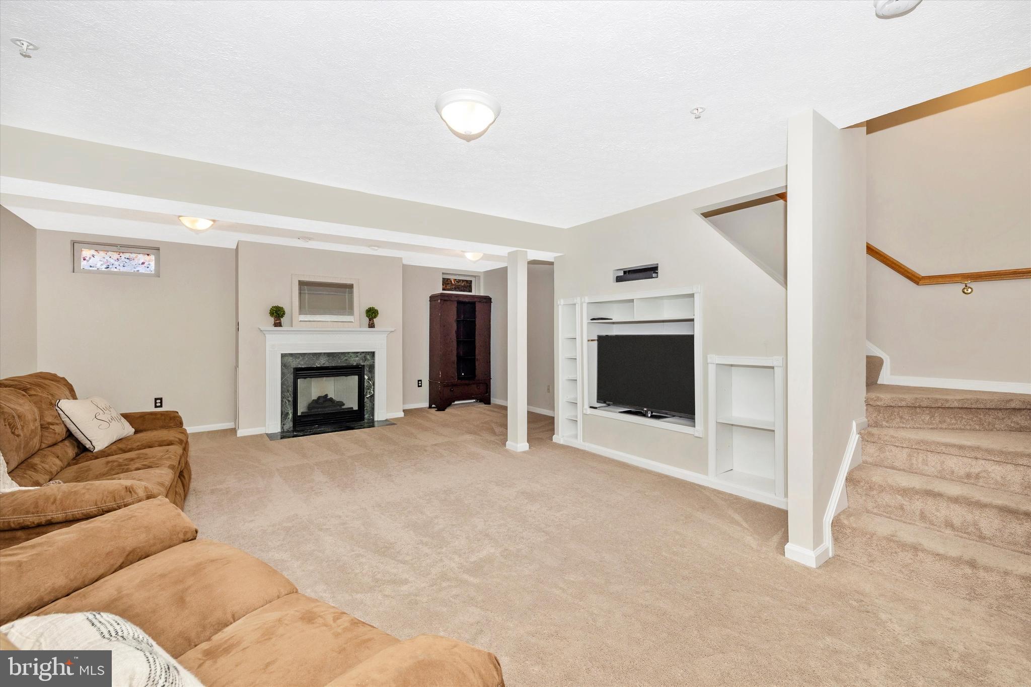 2010 Sumner Drive Frederick, MD 21702 - Photo 23 of 34 a living room with furniture and a fireplace