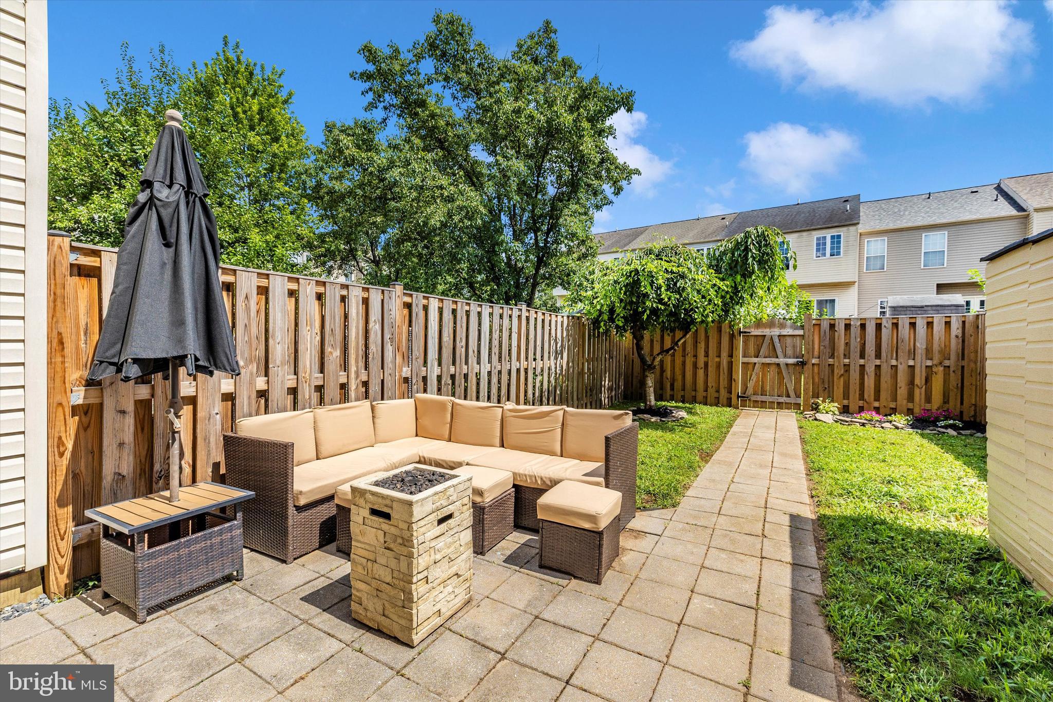 2010 Sumner Drive Frederick, MD 21702 - Photo 27 of 34 a view of a chairs and table in the back yard of the house