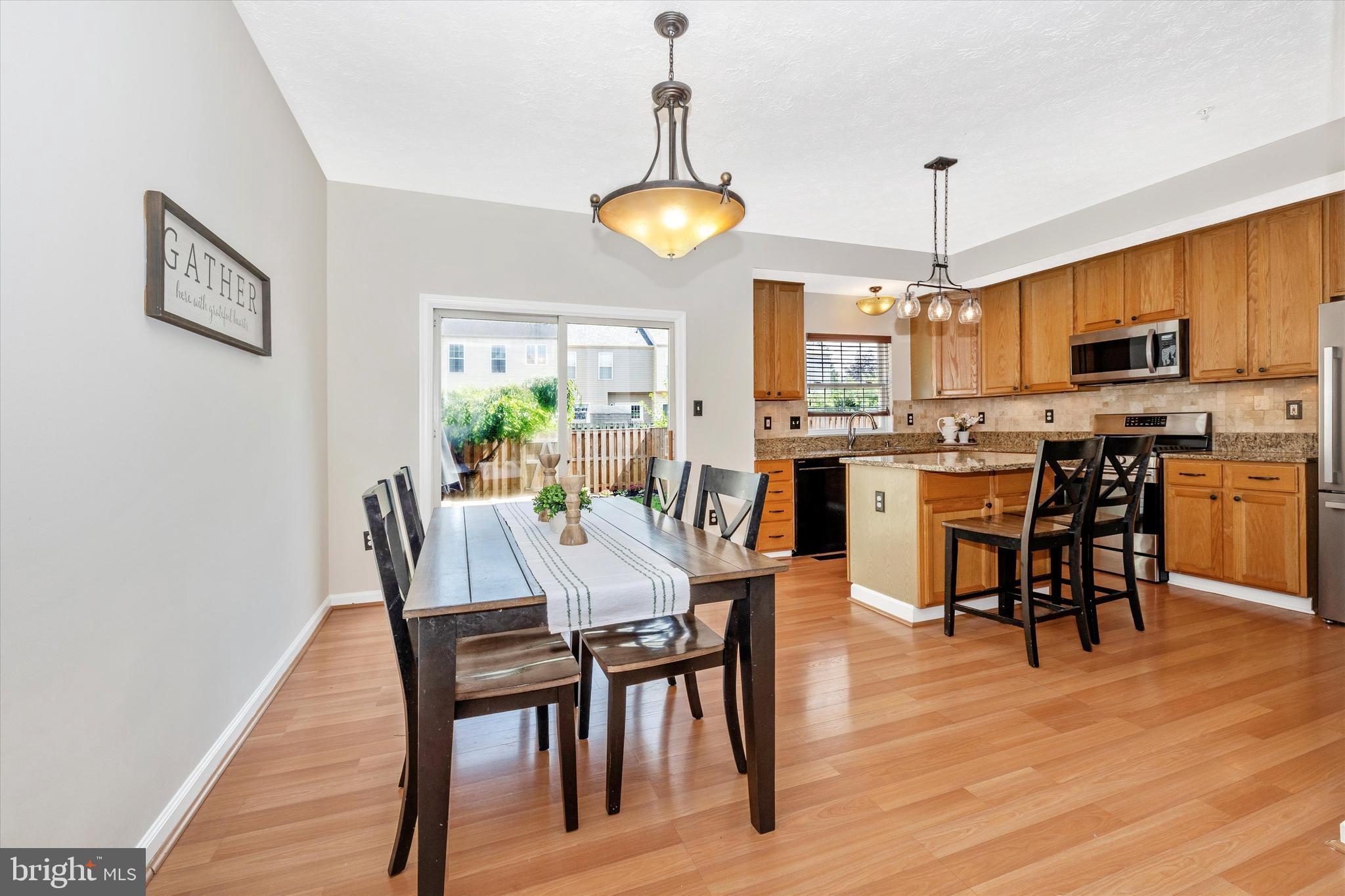 2010 Sumner Drive Frederick, MD 21702 - Photo 10 of 34 a view of a dining room with furniture window and wooden floor