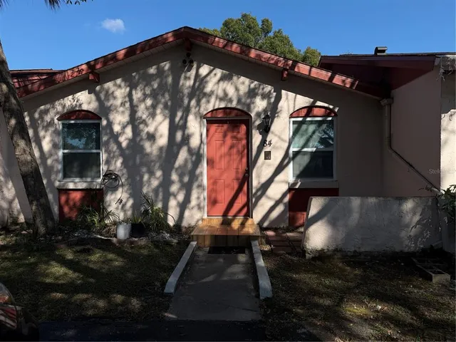a view of an chairs and table in the patio