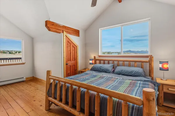 a bedroom with furniture and a window