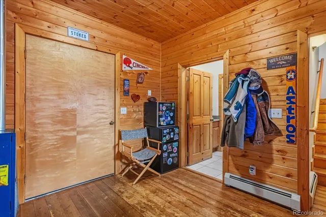 a view of walk in closet with clothes