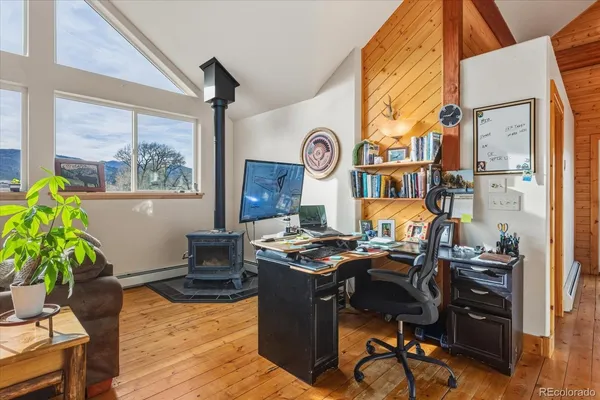 a workspace with furniture and a potted plant