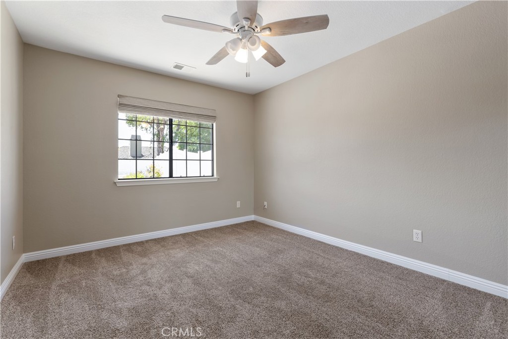 1275 Shane Lane Templeton, CA 93465 - Photo 43 of 70 an empty room with windows and fan