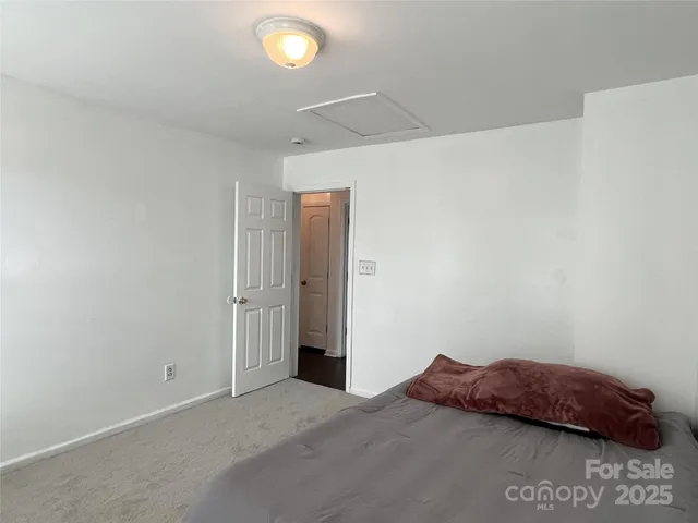 a bedroom with a bed and a cabinets