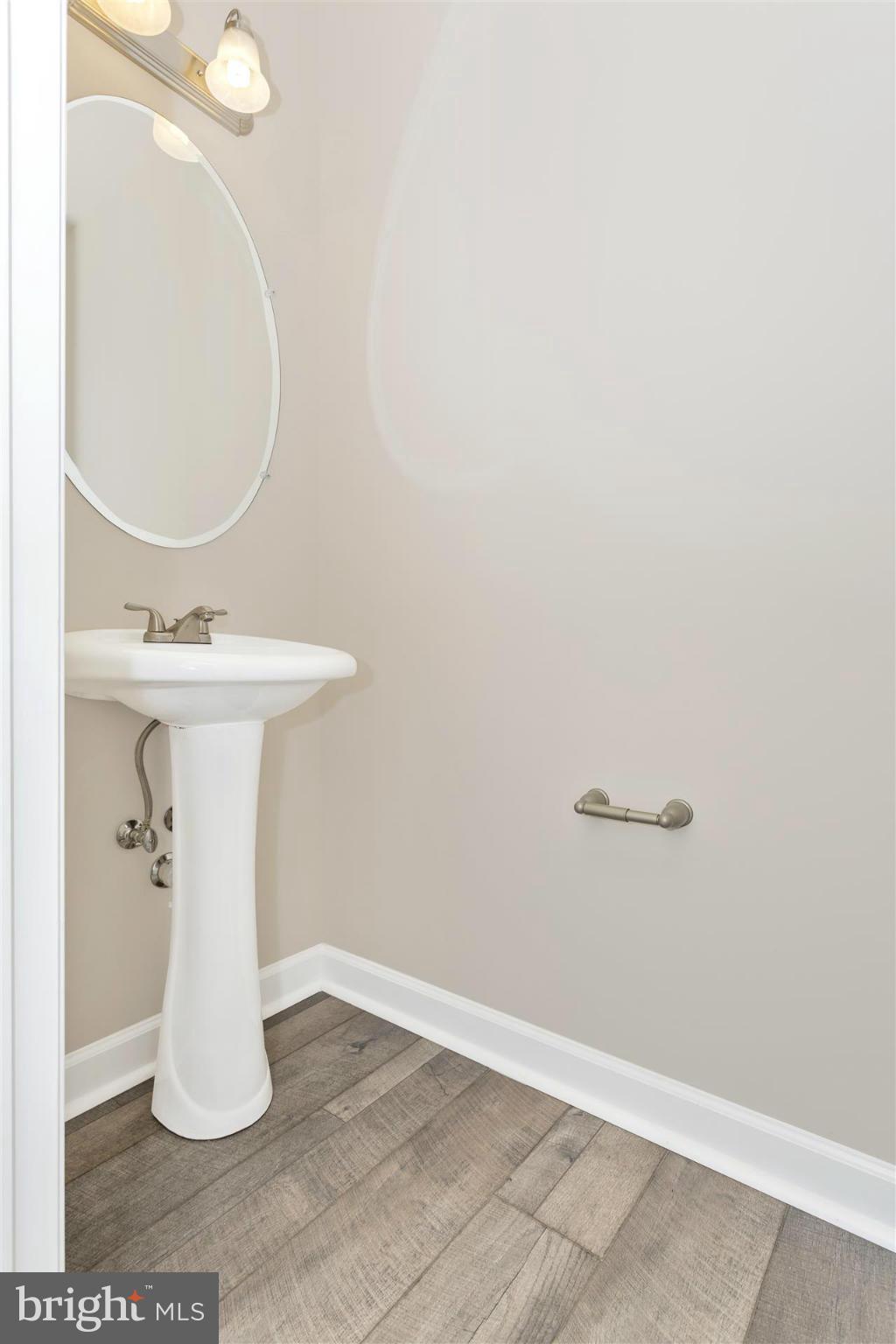 5309 Renn Road Frederick, MD 21703 - Photo 5 of 12 a bathroom with a sink a mirror and vanity