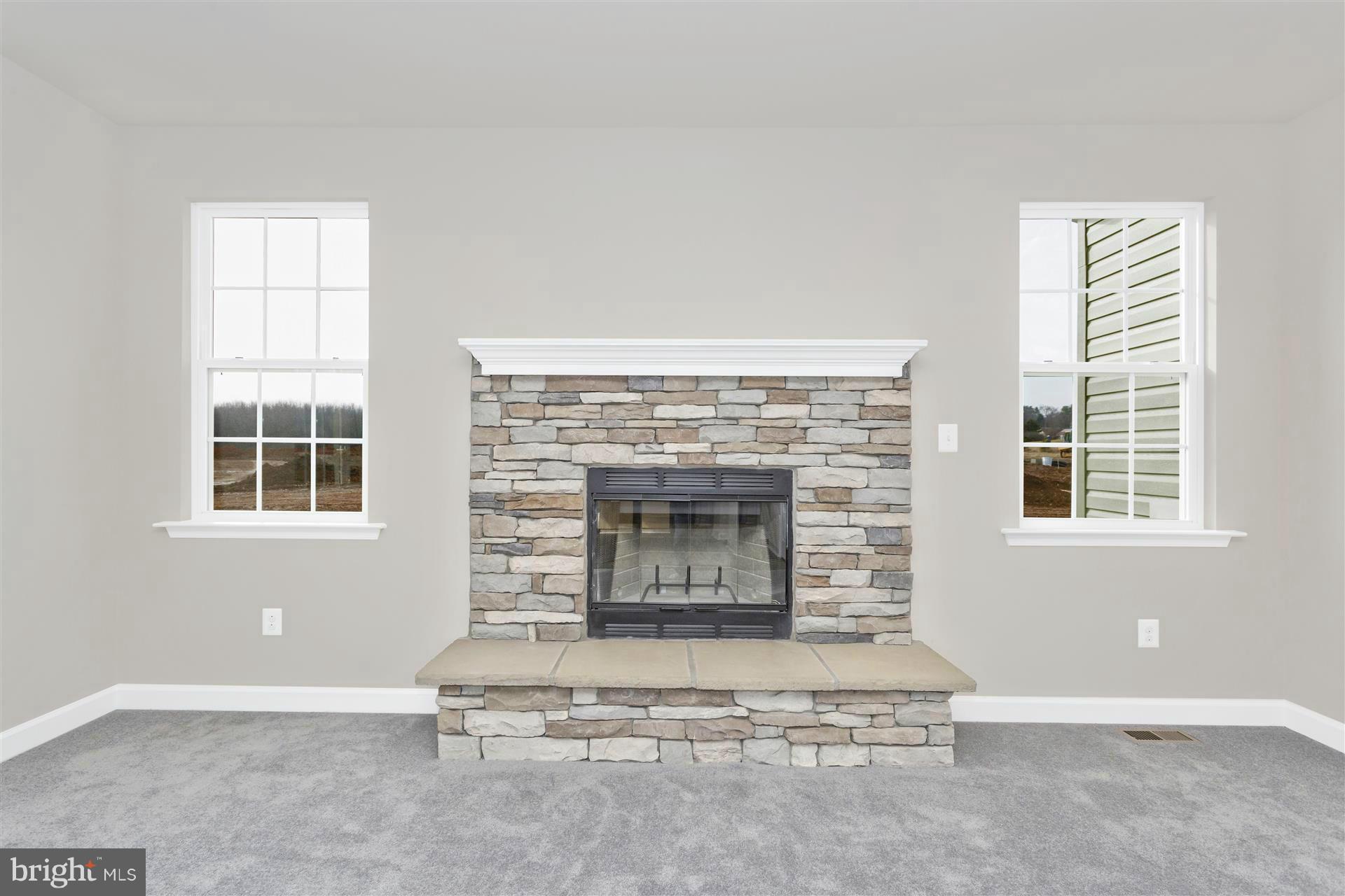 5309 Renn Road Frederick, MD 21703 - Photo 8 of 12 a living room with a fireplace and a floor