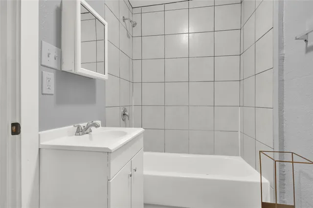 a bathroom with a sink toilet and vanity