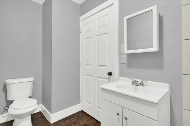 a kitchen with a refrigerator and a stove