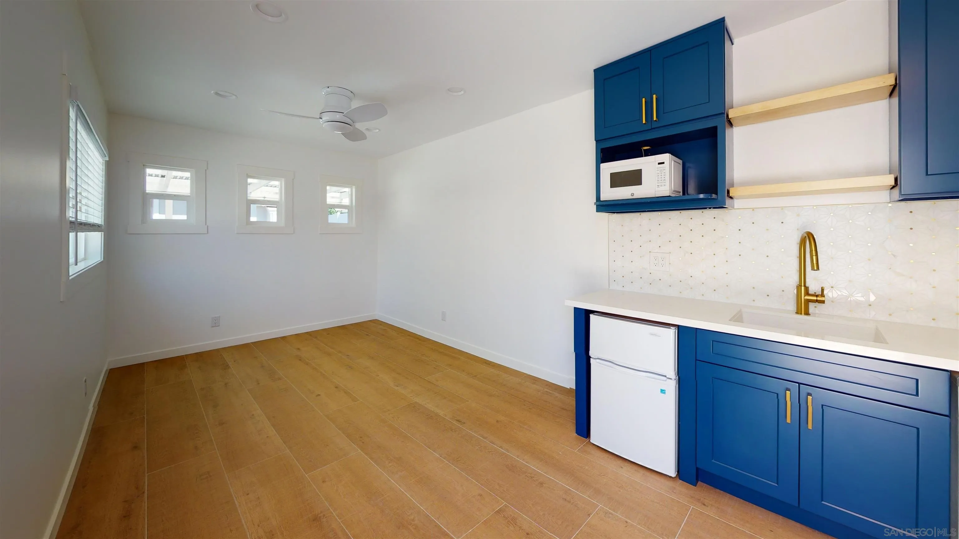 419 H Avenue Coronado, CA 92118 - Photo 21 of 32 a kitchen with a sink cabinets and wooden floor