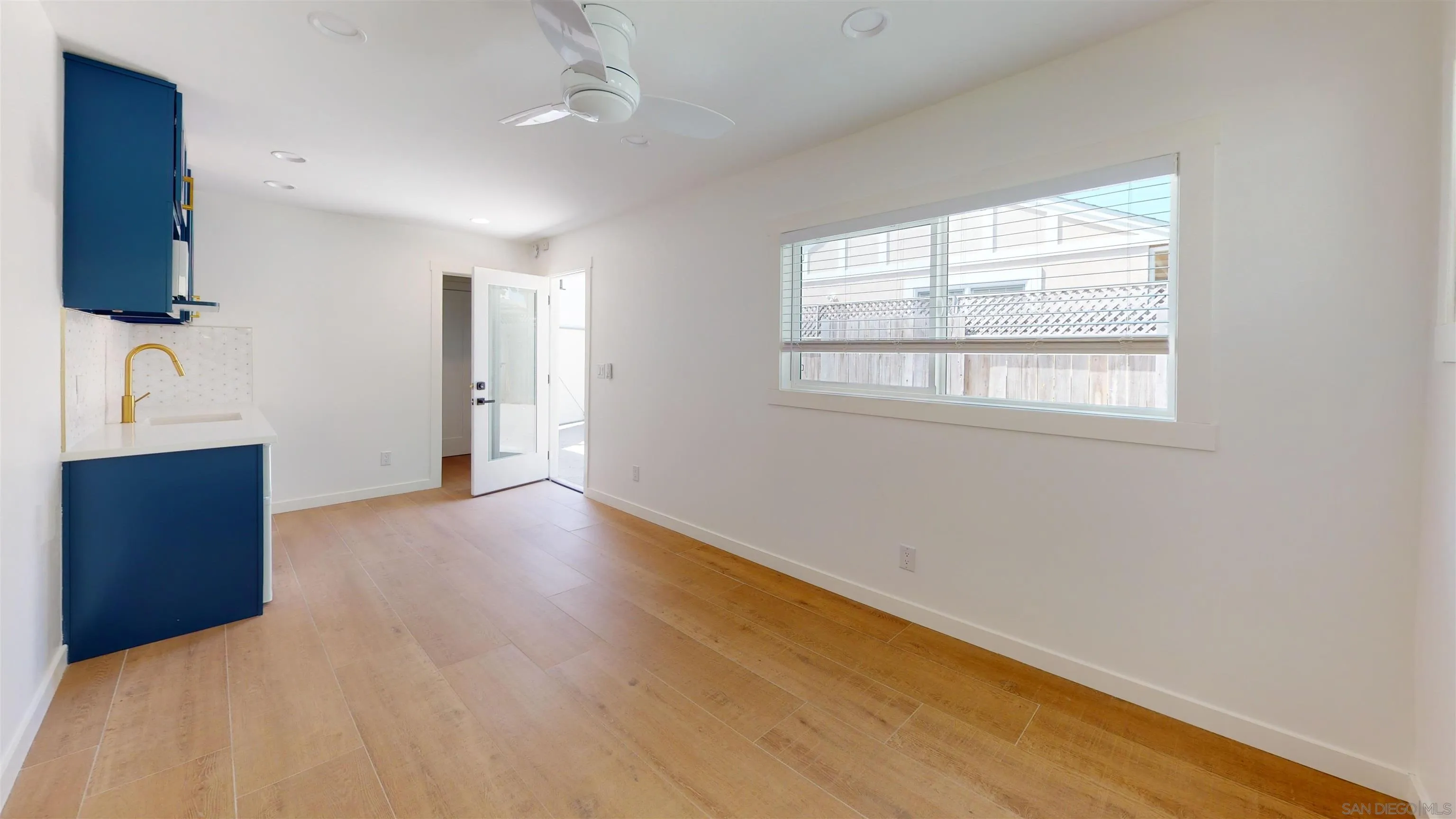 419 H Avenue Coronado, CA 92118 - Photo 23 of 32 an empty room with wooden floor and windows