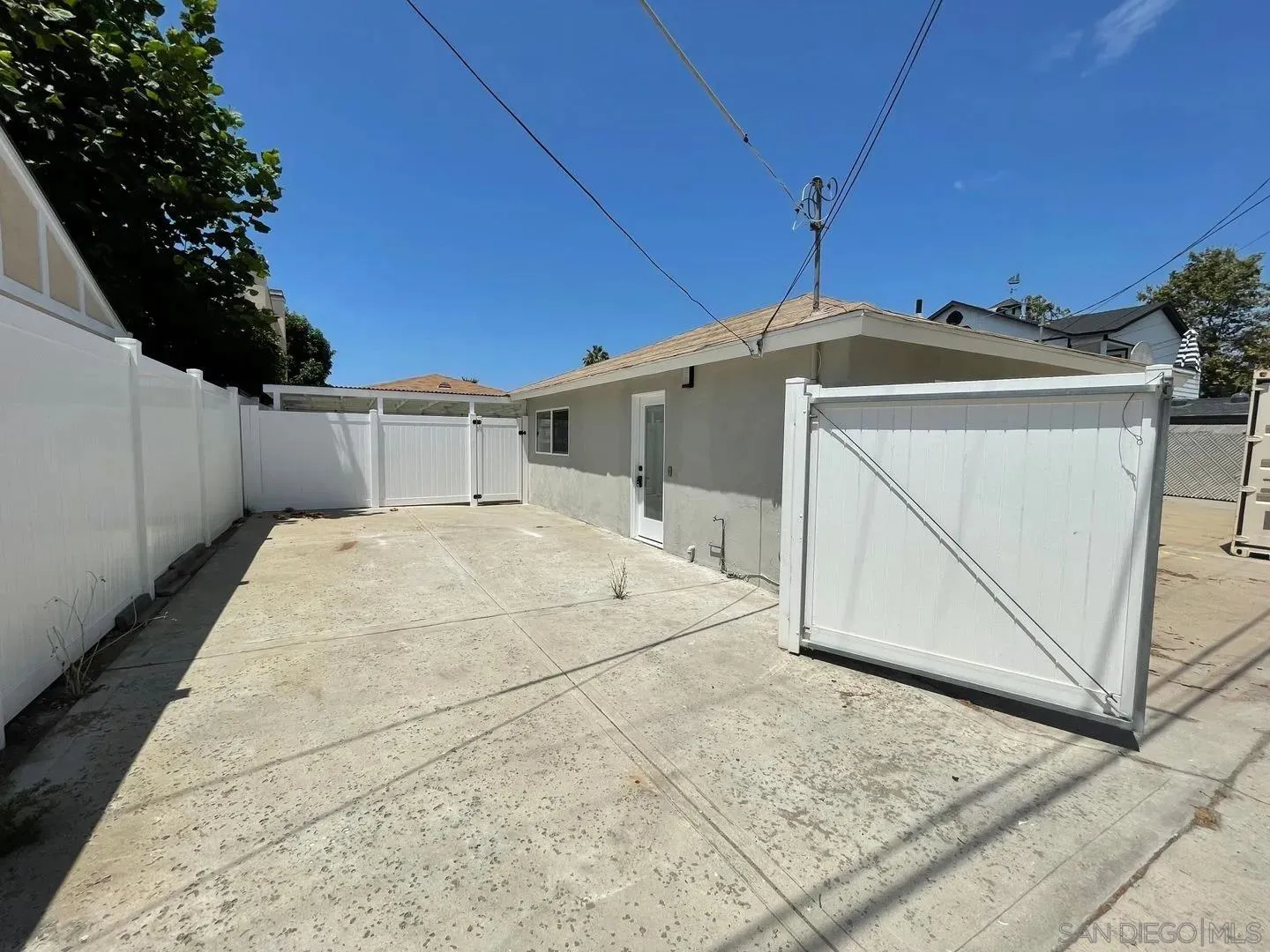 419 H Avenue Coronado, CA 92118 - Photo 25 of 32 a view of a white house with a outdoor space