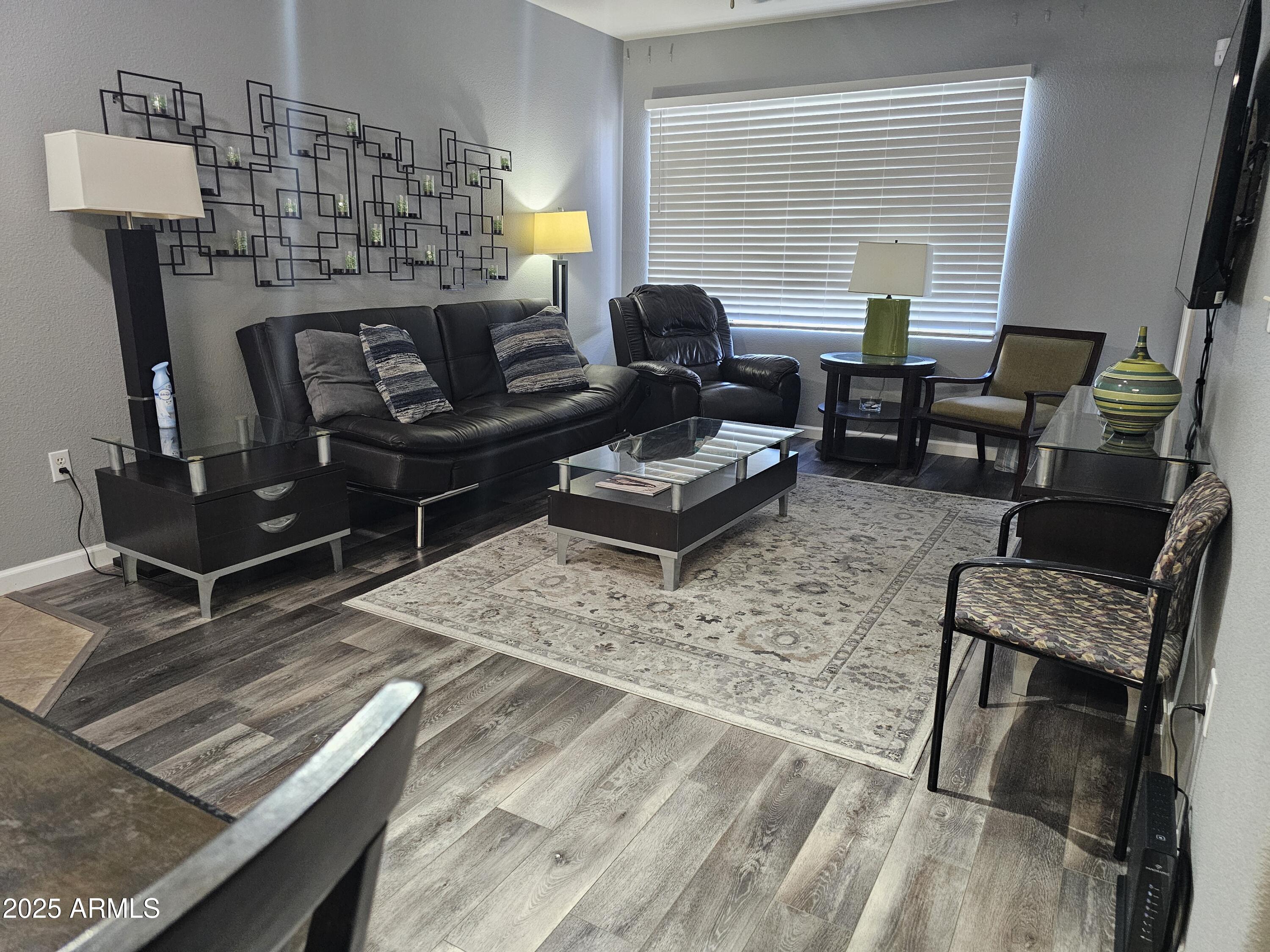 18416 North Cave Creek Road, Unit 2013 Phoenix, AZ 85032 - Photo 1 of 17 a living room with furniture and a fireplace