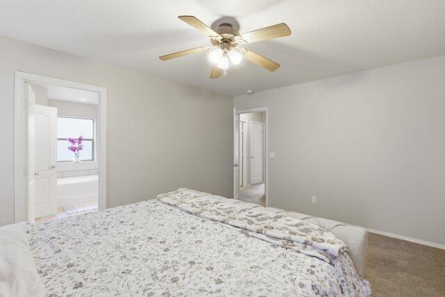 722 Boulder Ridge Road Payson, AZ 85541 - Photo 22 of 29 a bedroom with a bed and a chandelier
