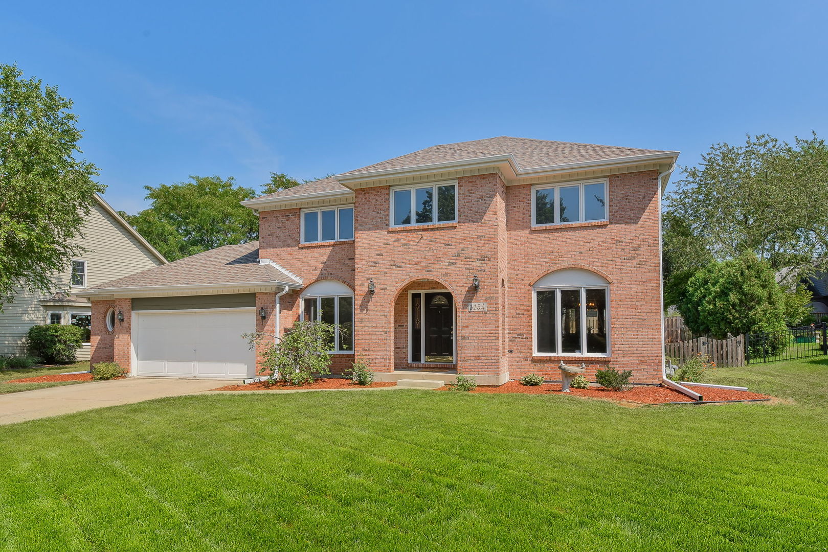 1154 Fagan Road Batavia, IL 60510 - Photo 1 of 37 a front view of house with yard and green space