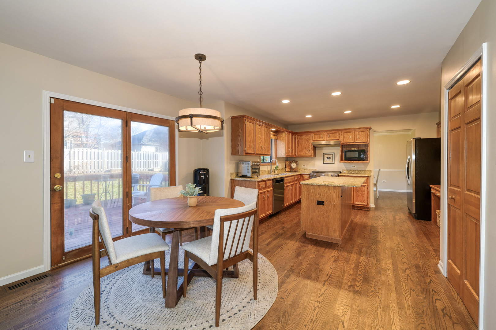 1154 Fagan Road Batavia, IL 60510 - Photo 17 of 37 a view of a dining room with furniture window and wooden floor