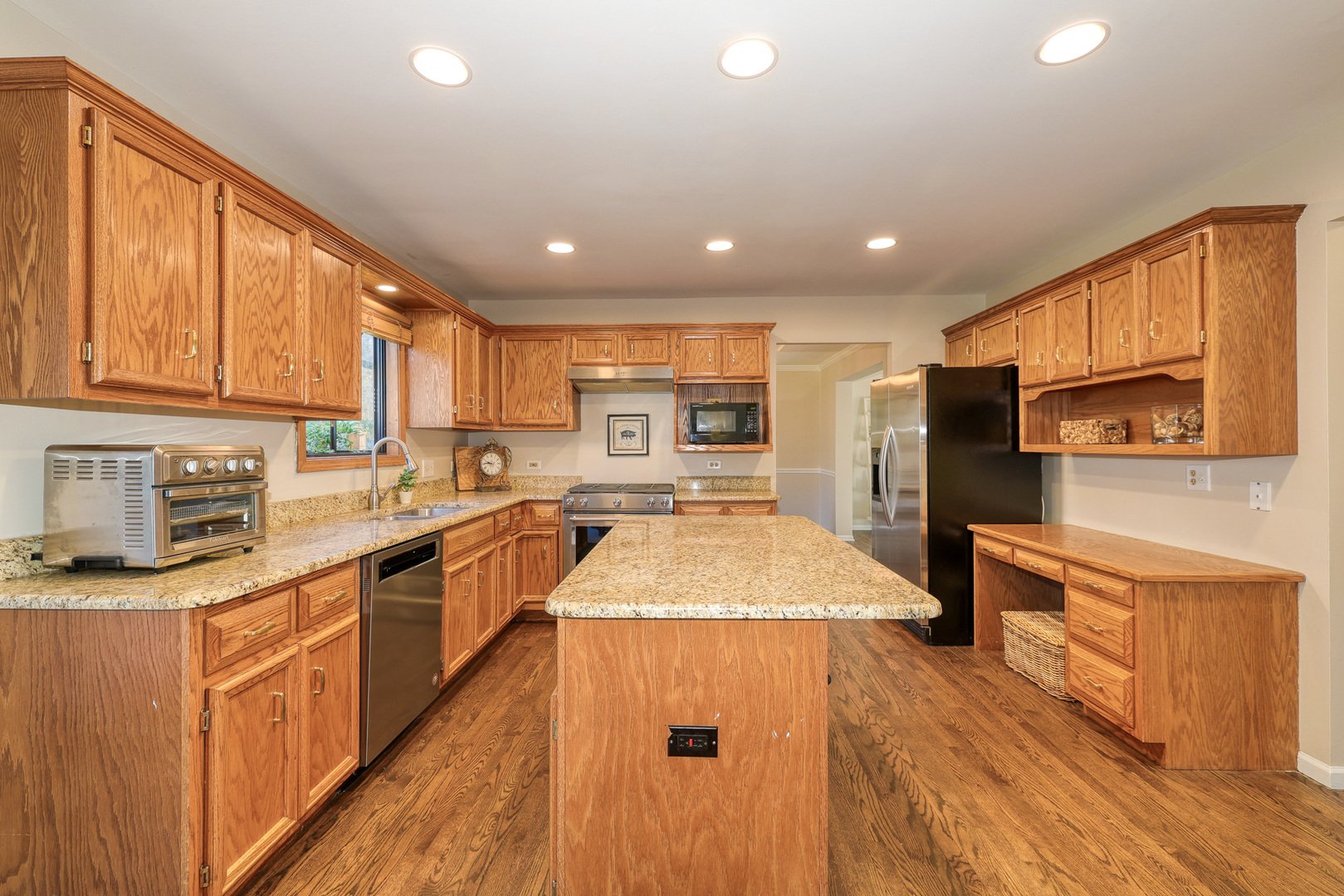 1154 Fagan Road Batavia, IL 60510 - Photo 18 of 37 a kitchen with stainless steel appliances granite countertop sink stove top oven and refrigerator
