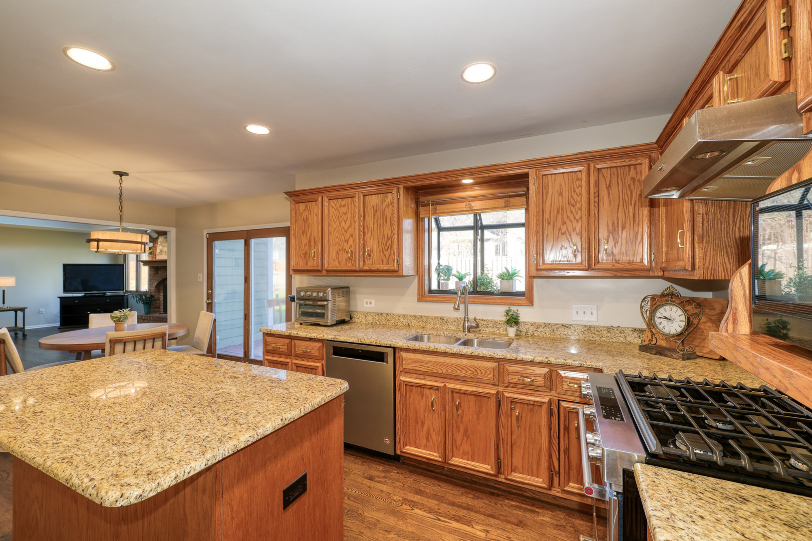 1154 Fagan Road Batavia, IL 60510 - Photo 20 of 37 a kitchen with stainless steel appliances granite countertop a sink stove and cabinets