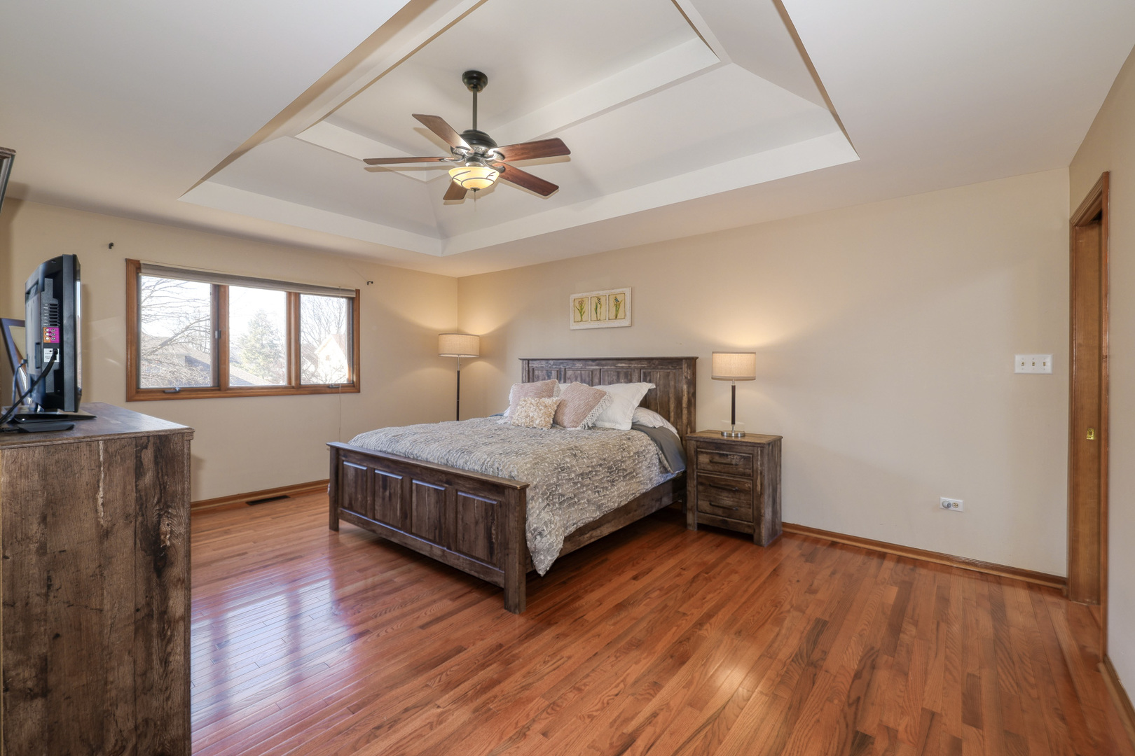 1154 Fagan Road Batavia, IL 60510 - Photo 27 of 37 a bedroom with a bed and wooden floor