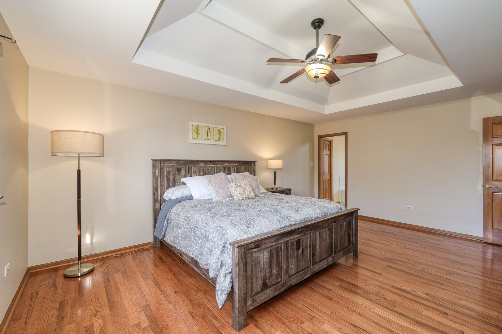 1154 Fagan Road Batavia, IL 60510 - Photo 28 of 37 a bedroom with a bed and a chandelier