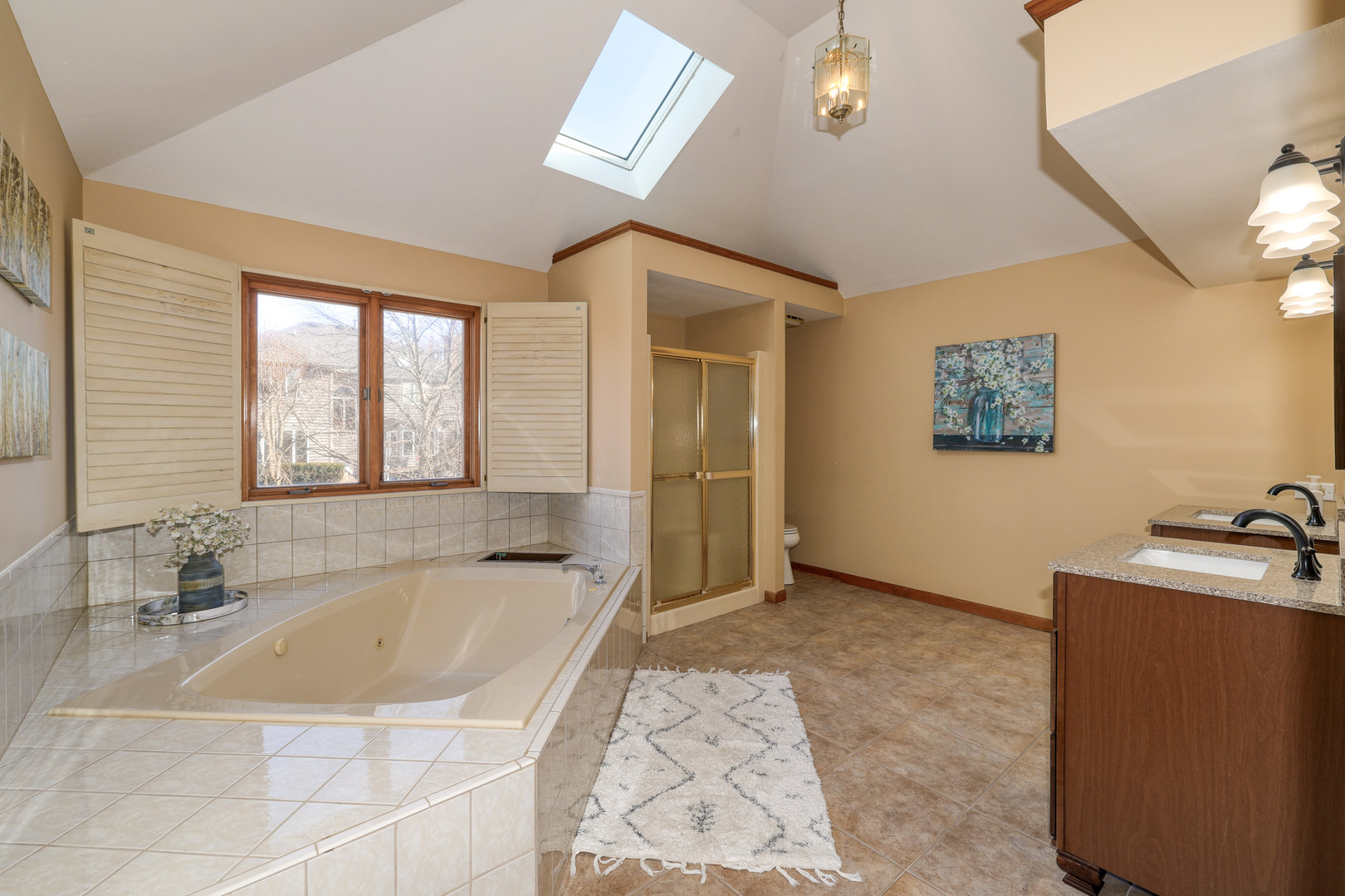 1154 Fagan Road Batavia, IL 60510 - Photo 31 of 37 a spacious bathroom with a tub a sink and mirror