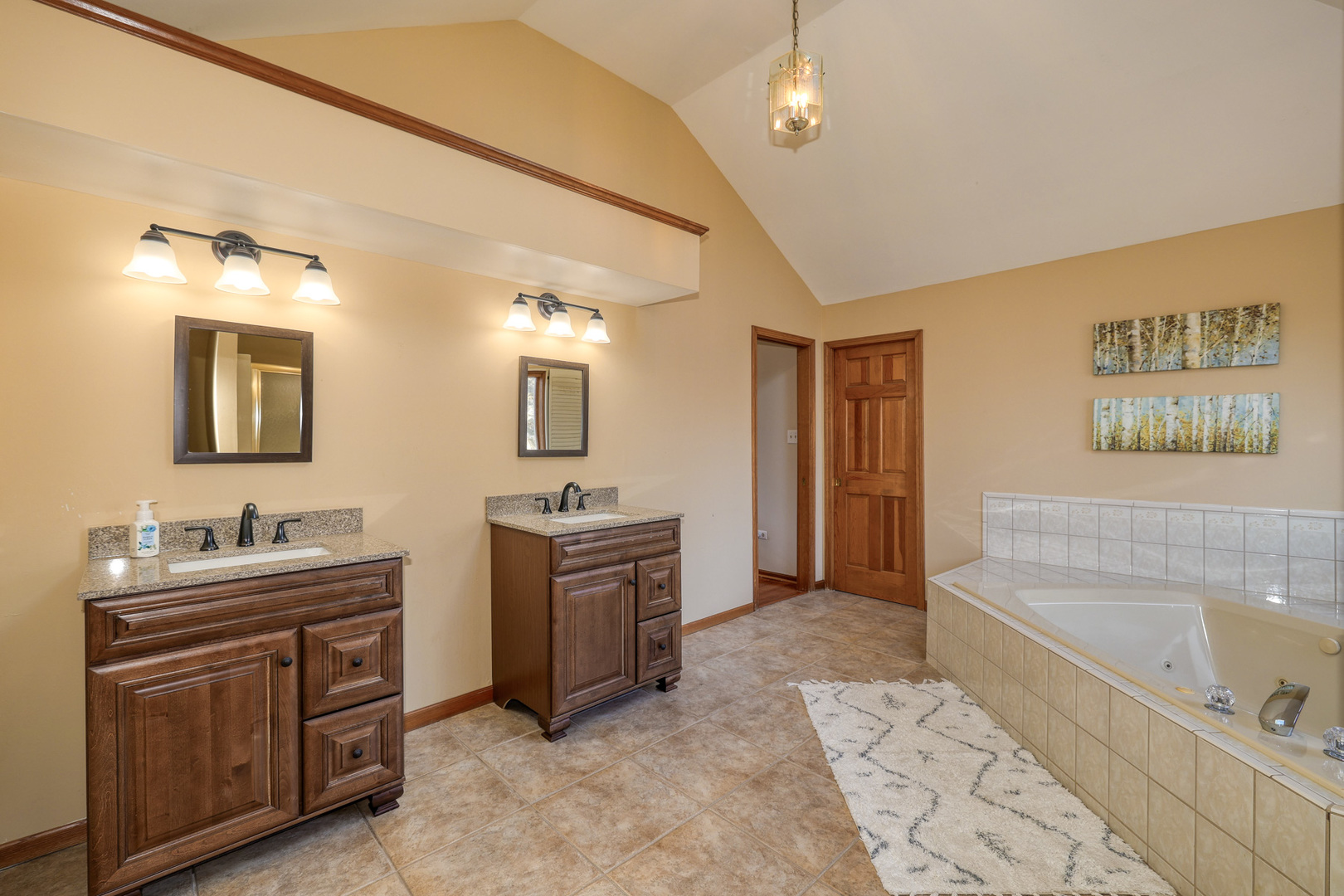 1154 Fagan Road Batavia, IL 60510 - Photo 32 of 37 a spacious bathroom with a tub sink and mirror