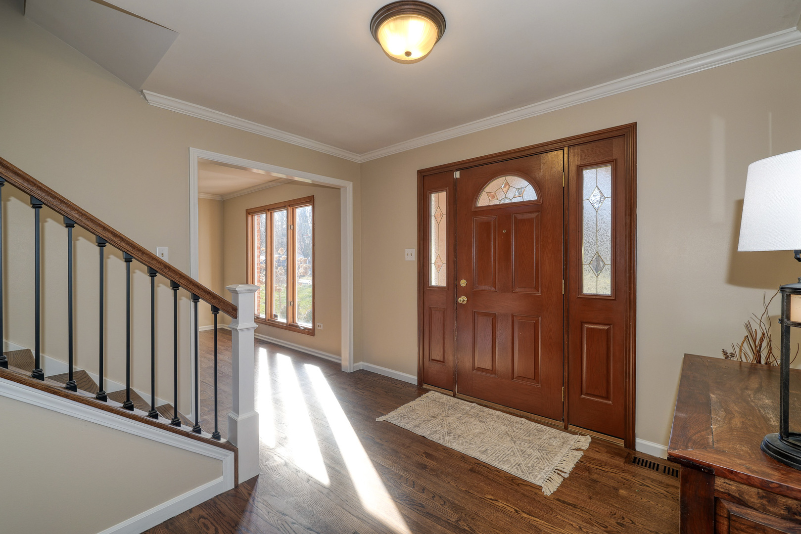 1154 Fagan Road Batavia, IL 60510 - Photo 4 of 37 a view of a hallway with wooden floor and windows
