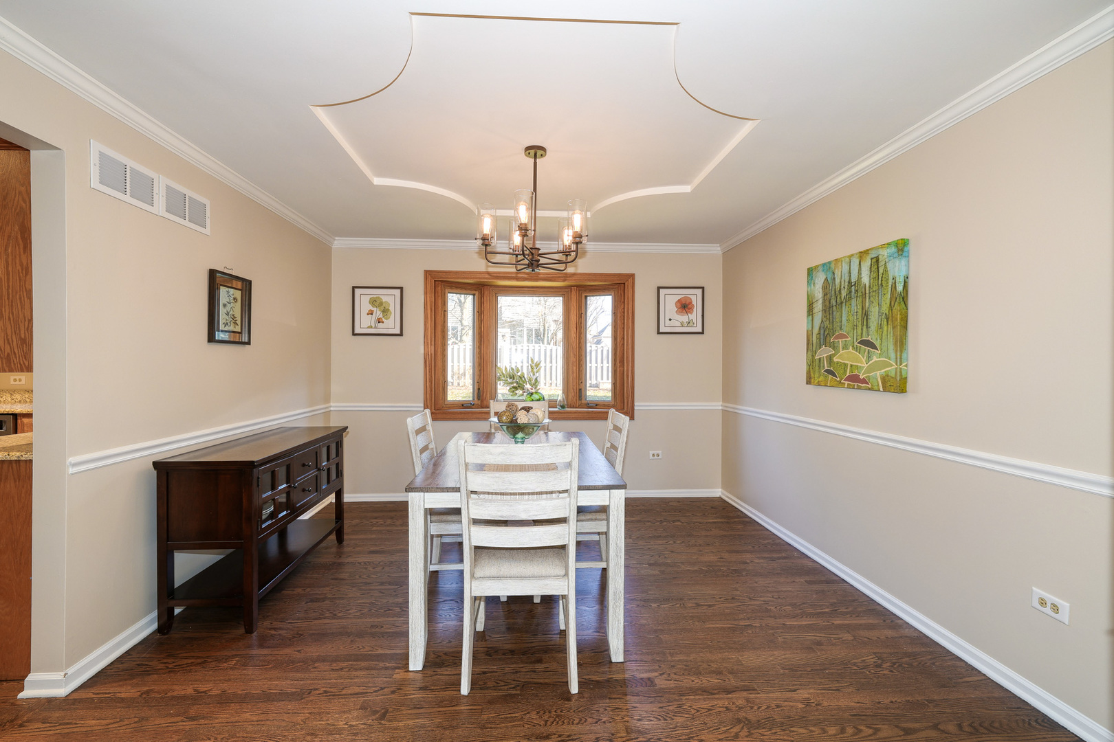 1154 Fagan Road Batavia, IL 60510 - Photo 9 of 37 a dining room with wooden floor a chandelier a wooden table and chairs