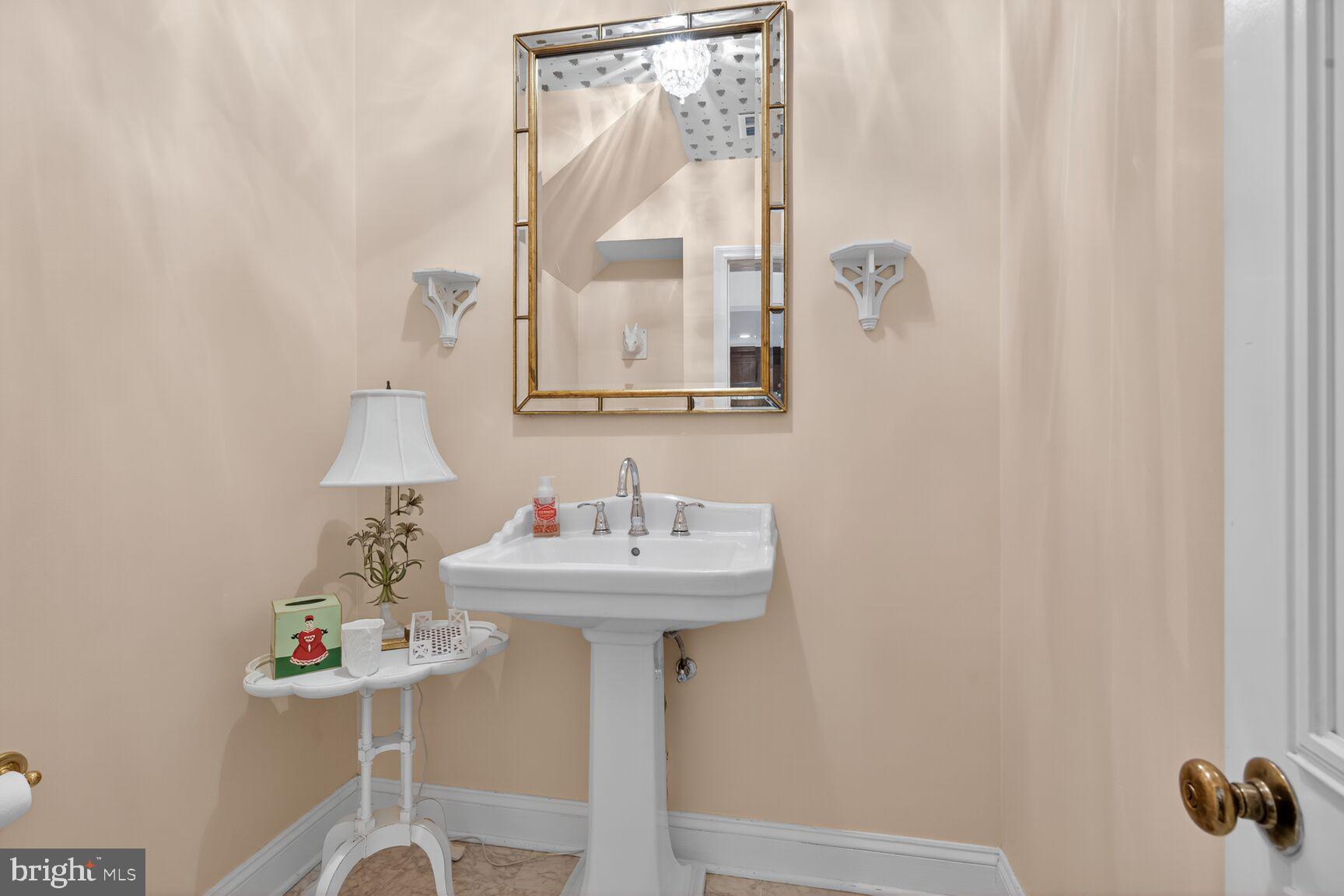 7200 Helmsdale Road Bethesda, MD 20817 - Photo 11 of 50 a bathroom with a sink mirror and vanity