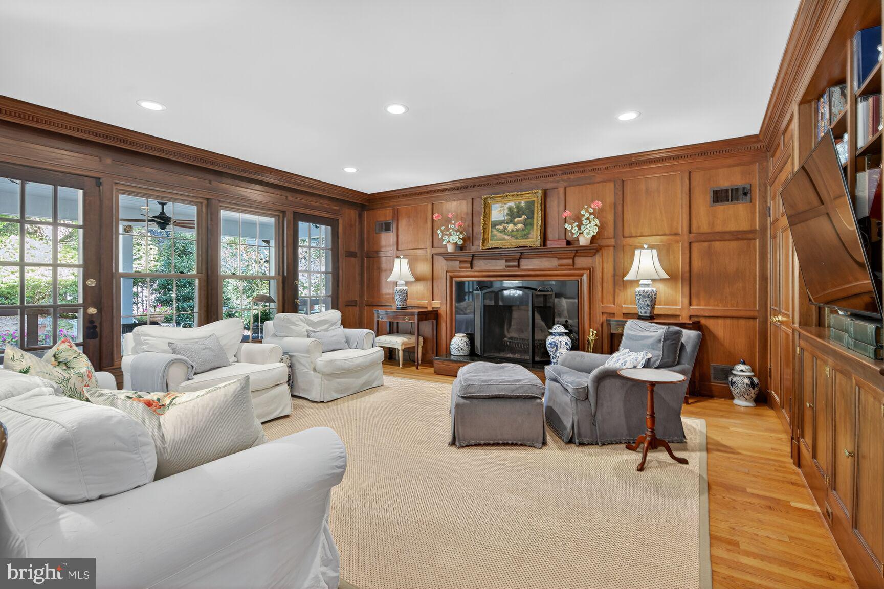 7200 Helmsdale Road Bethesda, MD 20817 - Photo 12 of 50 a living room with furniture large window and a fireplace