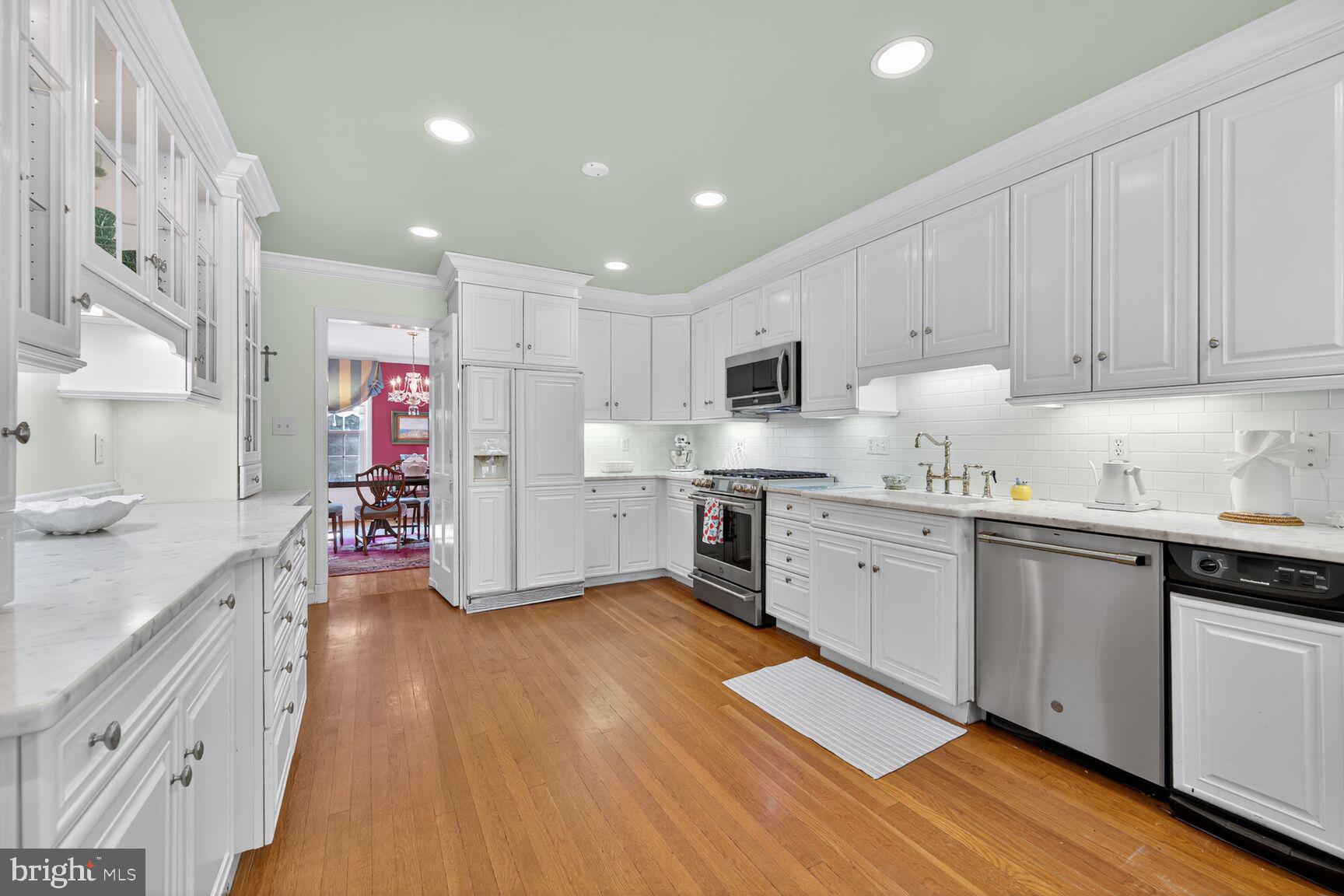 7200 Helmsdale Road Bethesda, MD 20817 - Photo 18 of 50 a kitchen with granite countertop a sink cabinets and stainless steel appliances