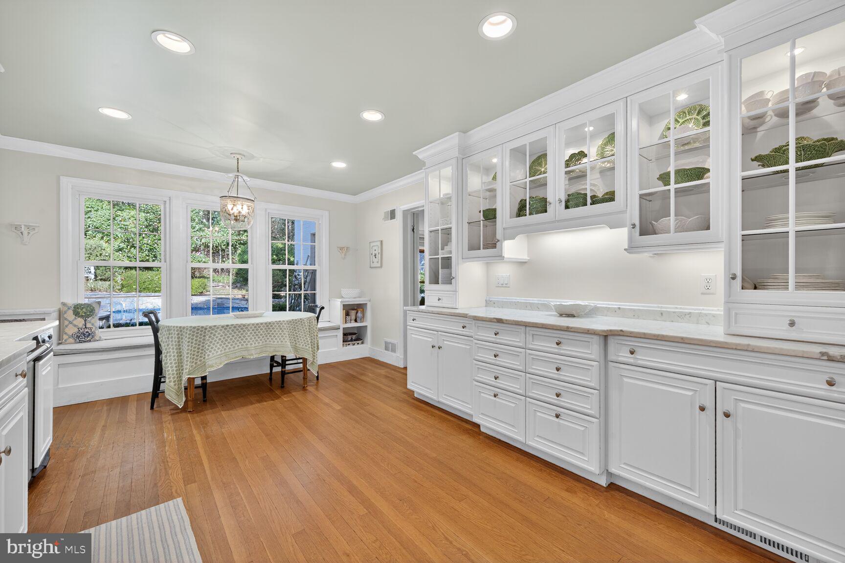 7200 Helmsdale Road Bethesda, MD 20817 - Photo 20 of 50 a spacious bedroom with a large bed and a large window