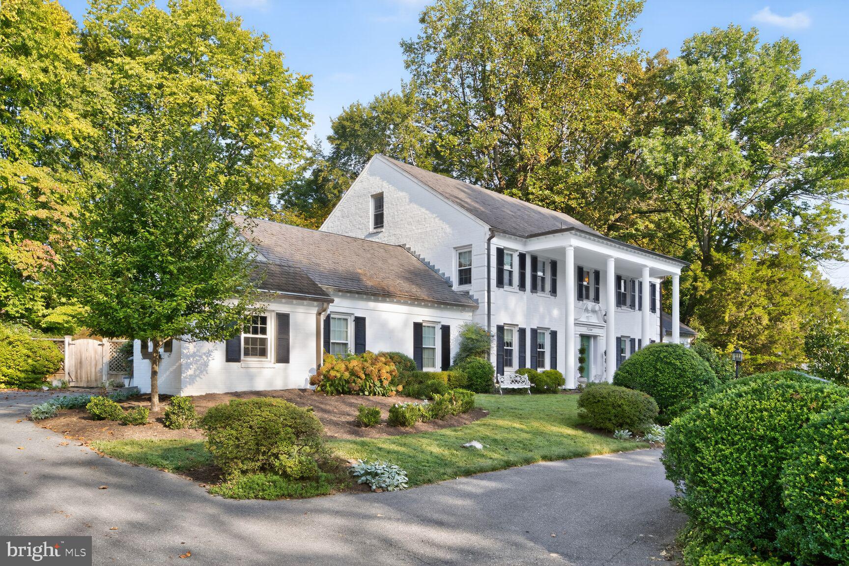7200 Helmsdale Road Bethesda, MD 20817 - Photo 2 of 50 a front view of a house with a yard