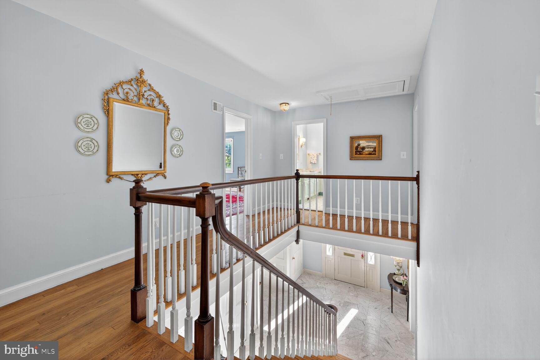 7200 Helmsdale Road Bethesda, MD 20817 - Photo 27 of 50 a view of staircase with wooden floor and white walls