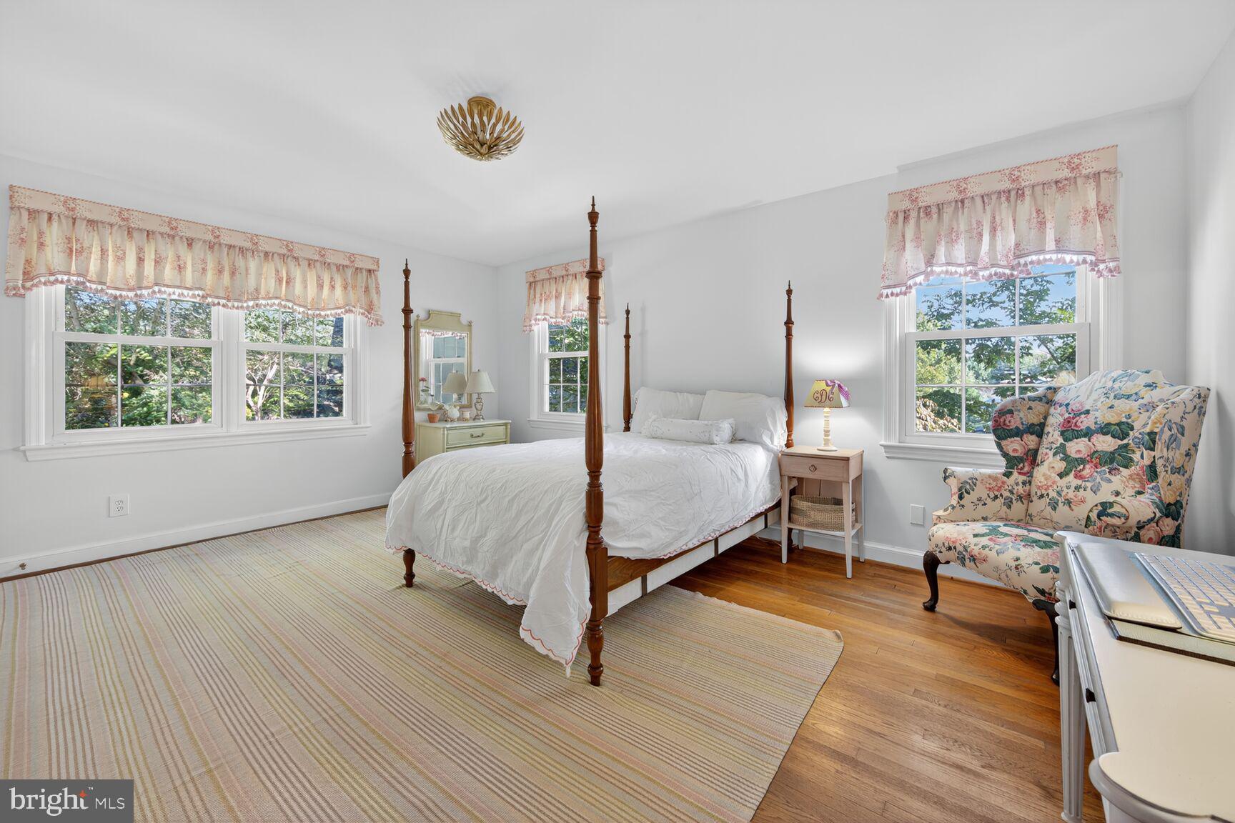 7200 Helmsdale Road Bethesda, MD 20817 - Photo 29 of 50 a bed room with a bed and a chair