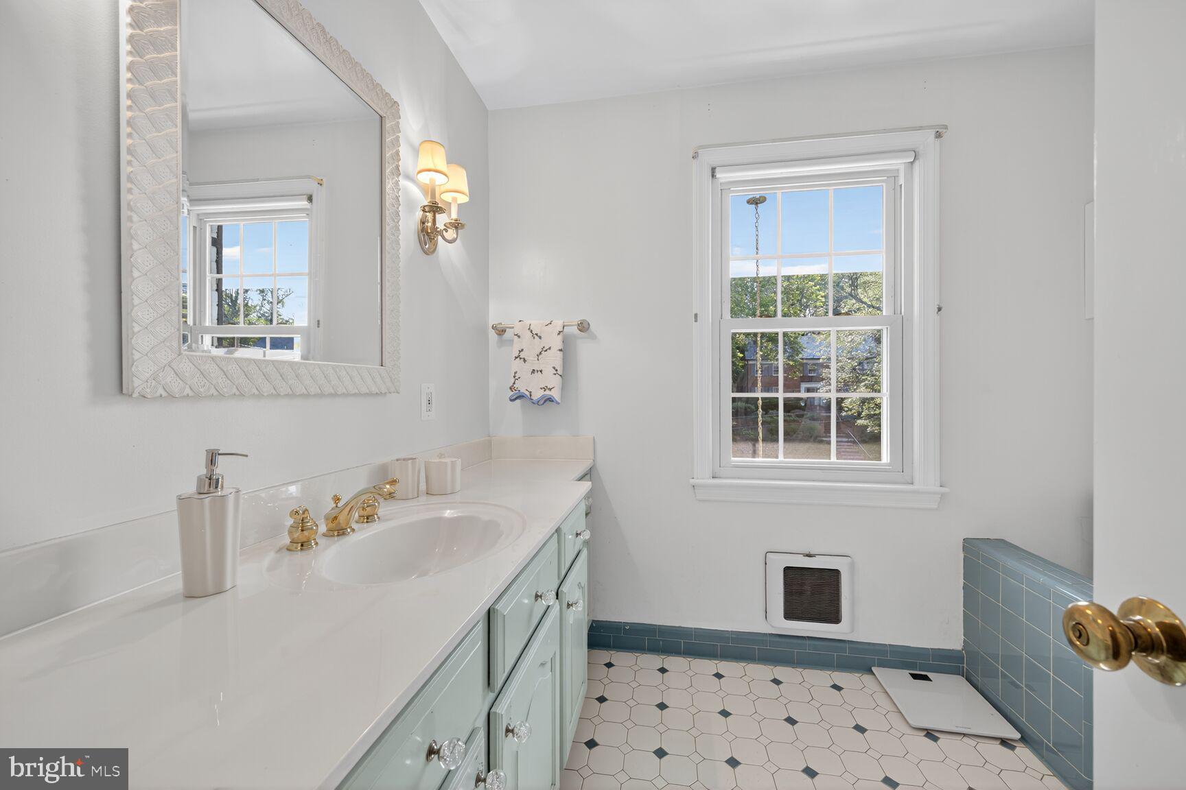 7200 Helmsdale Road Bethesda, MD 20817 - Photo 36 of 50 a bathroom with a sink a toilet and shower